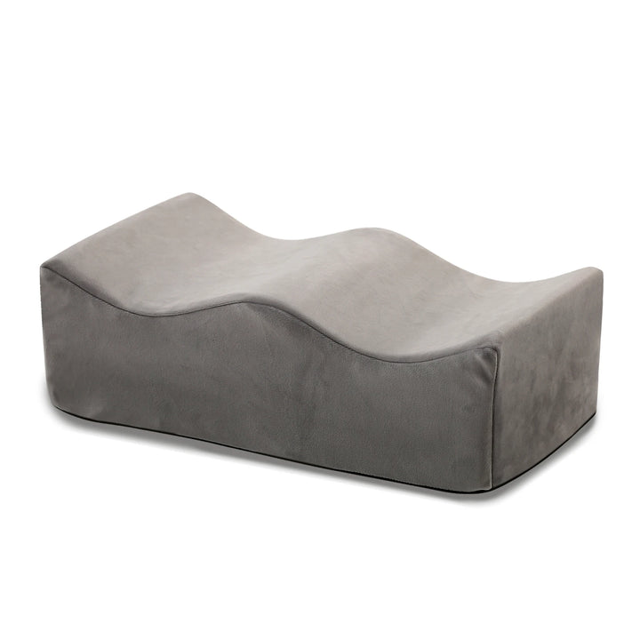 Coussin repose-jambes gris à profil en vagues
